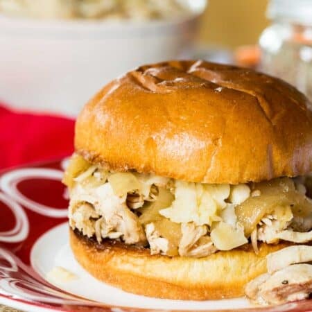 A shredded chicken sandwich on a bun.