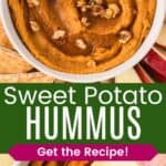 A bowl of an orange-colored dip topped with walnuts and maple syrup and an apple slice being dipped in it divided by a green box with text overlay that says "Sweet Potato Hummus" and the words "Get the Recipe!".