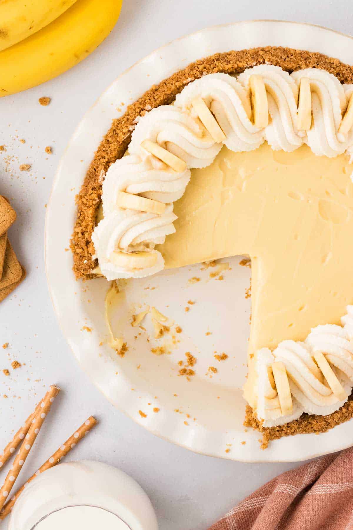 Overhead image of gluten free banana cream pie with a slice taken from it.