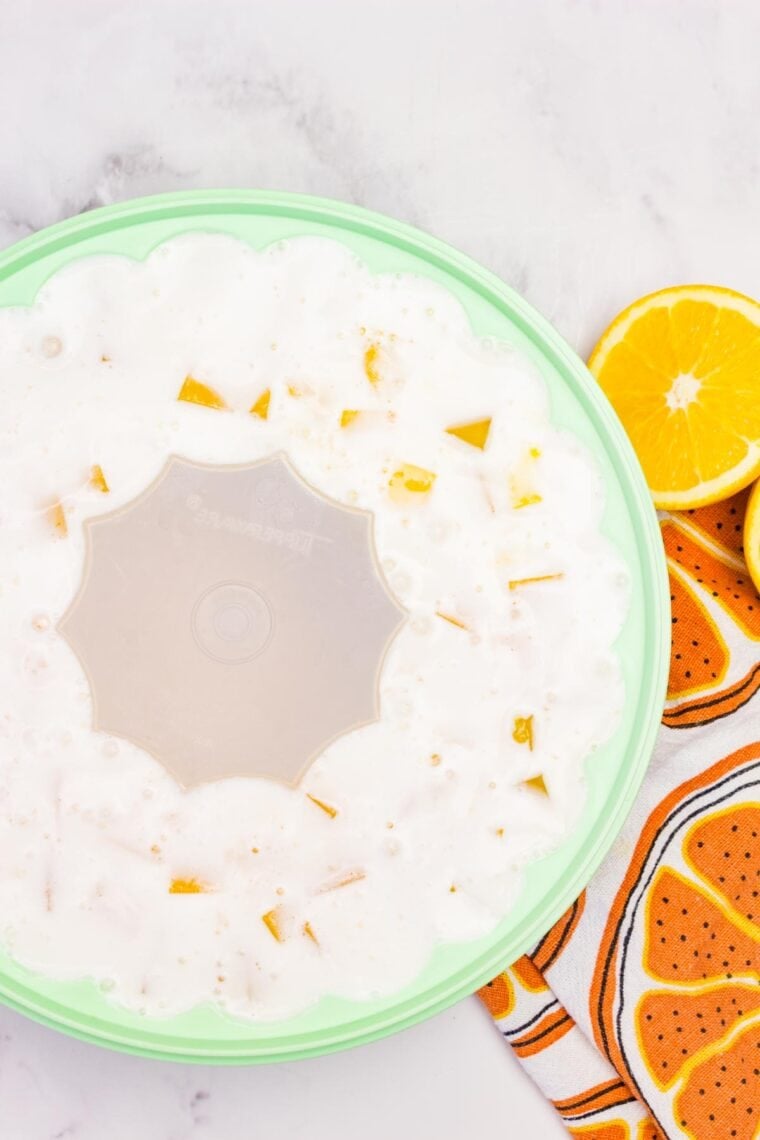 Orange creamsicle jello in a jello mold.