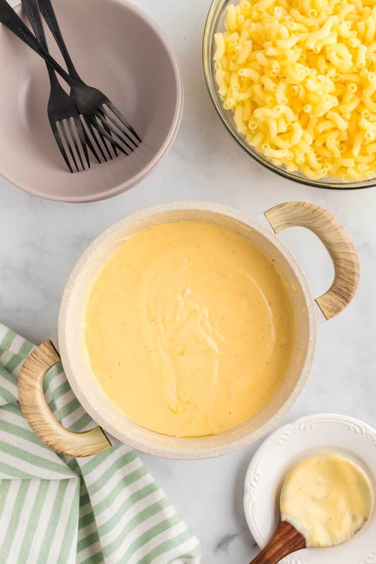 This gluten-free mac and cheese is so creamy and satisfying, with a crunchy breadcrumb topping that takes it over the edge! Cheesy sauce for mac and cheese.