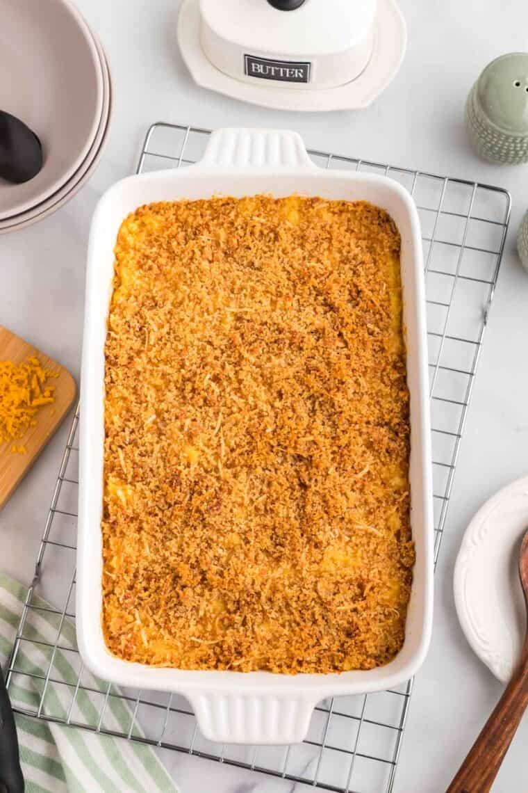 This gluten-free mac and cheese is so creamy and satisfying, with a crunchy breadcrumb topping that takes it over the edge! Overhead image of gluten free mac and cheese with a crispy breadcrumb topping.