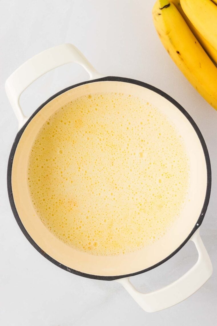 Thickening the filling for banana cream pie in a saucepan.