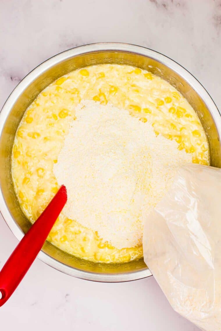 This wildly easy gluten-free corn casserole combines sweet and savory goodness with a creamy texture that’s guaranteed to be a hit. Adding cornbread mix to corn casserole batter.