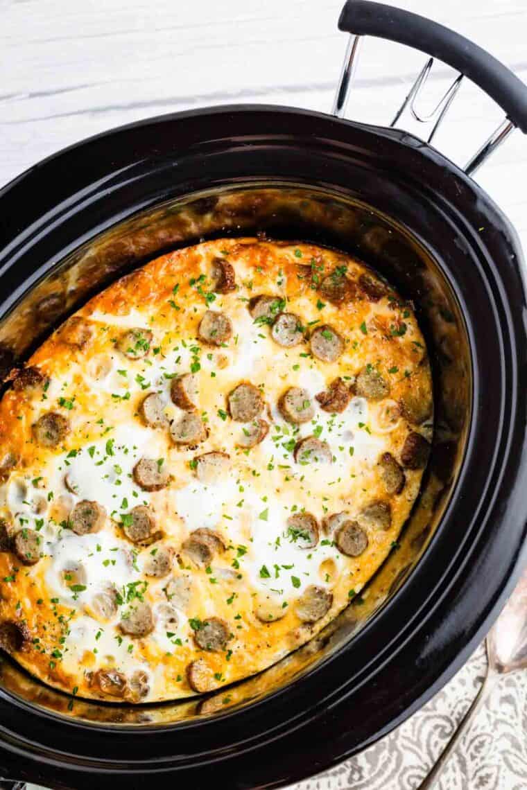 Overhead image of cauliflower hash brown casserole in a slow cooker.