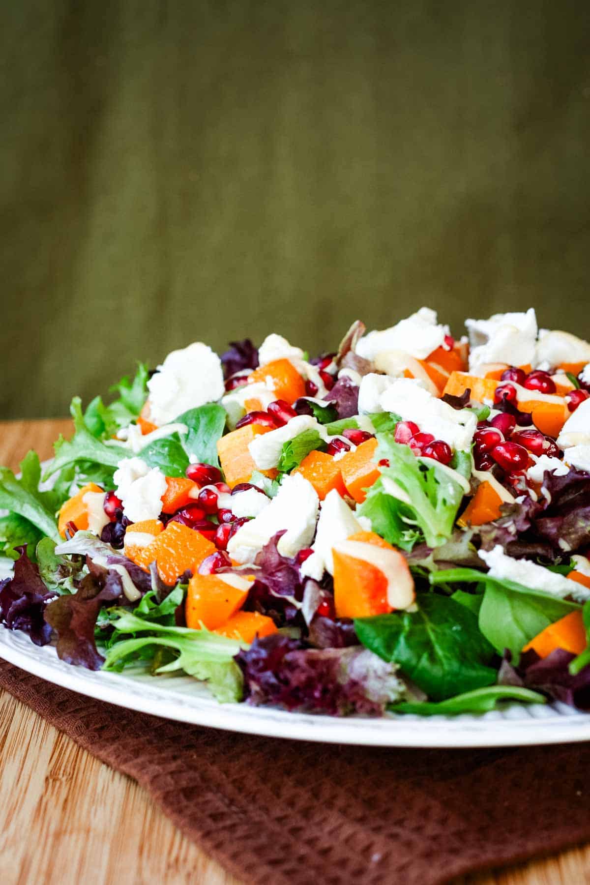 Butternut squash salad served on a plate.