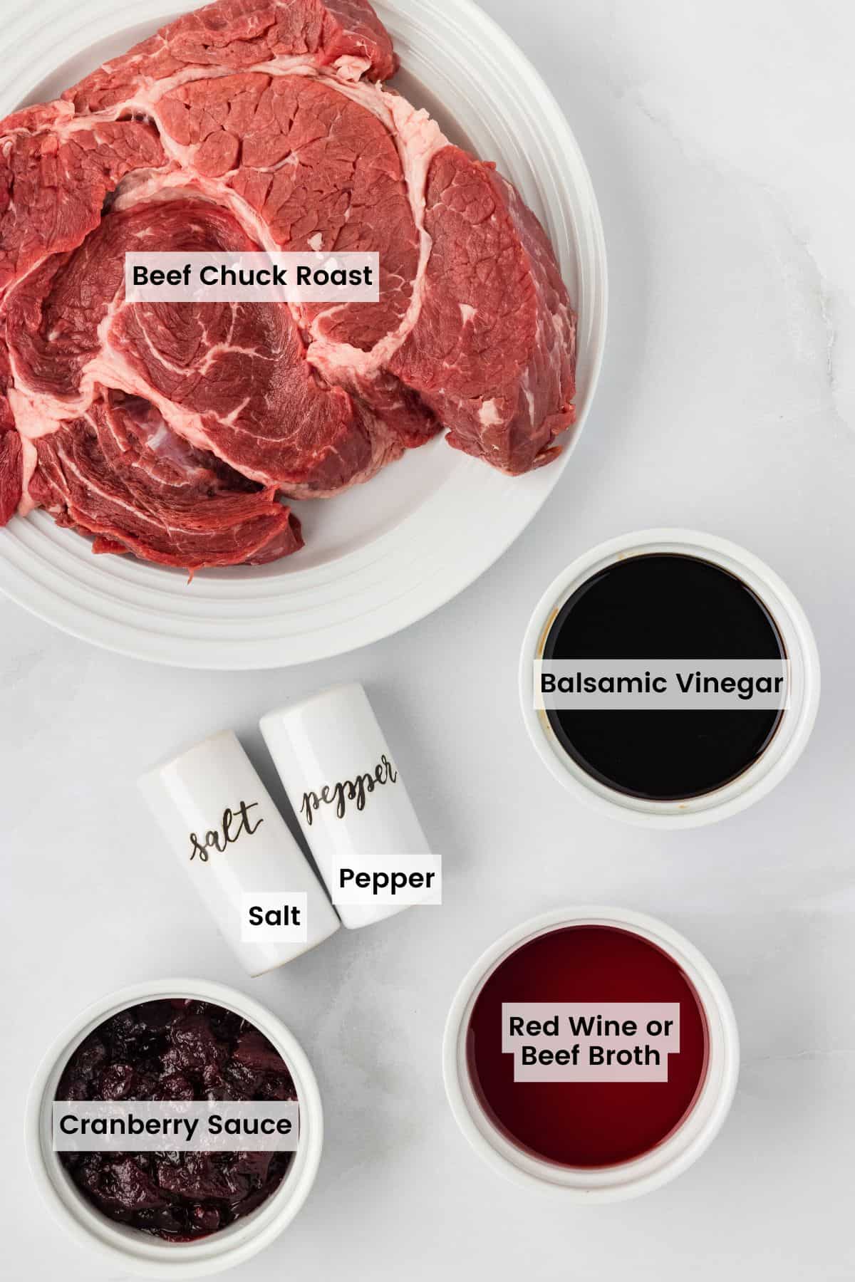 Slow cooker balsamic beef is the answer to your holiday hosting dreams, delivering melt-in-your-mouth beef in a tangy, subtly sweet sauce. Labeled ingredients for cranberry balsamic beef.