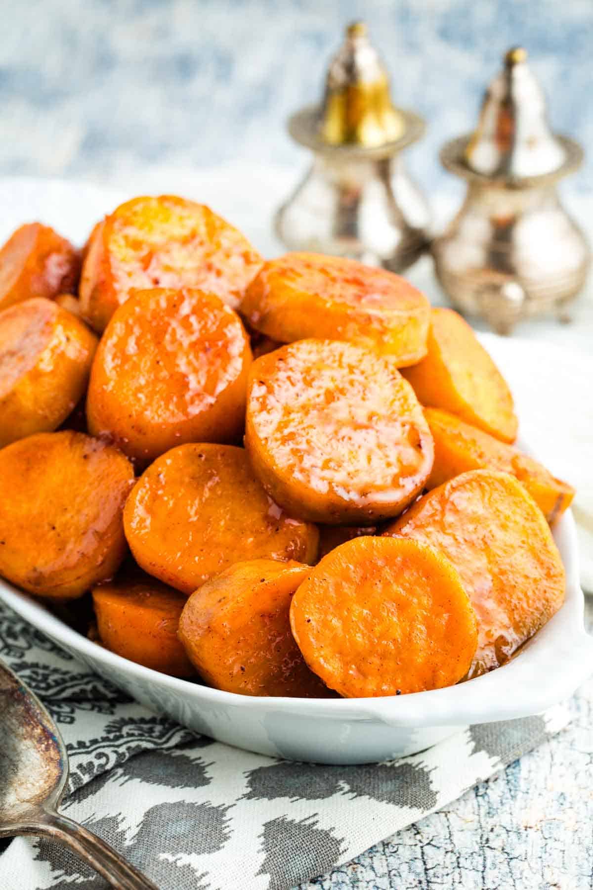 Candied sweet potatoes in a serving dish.