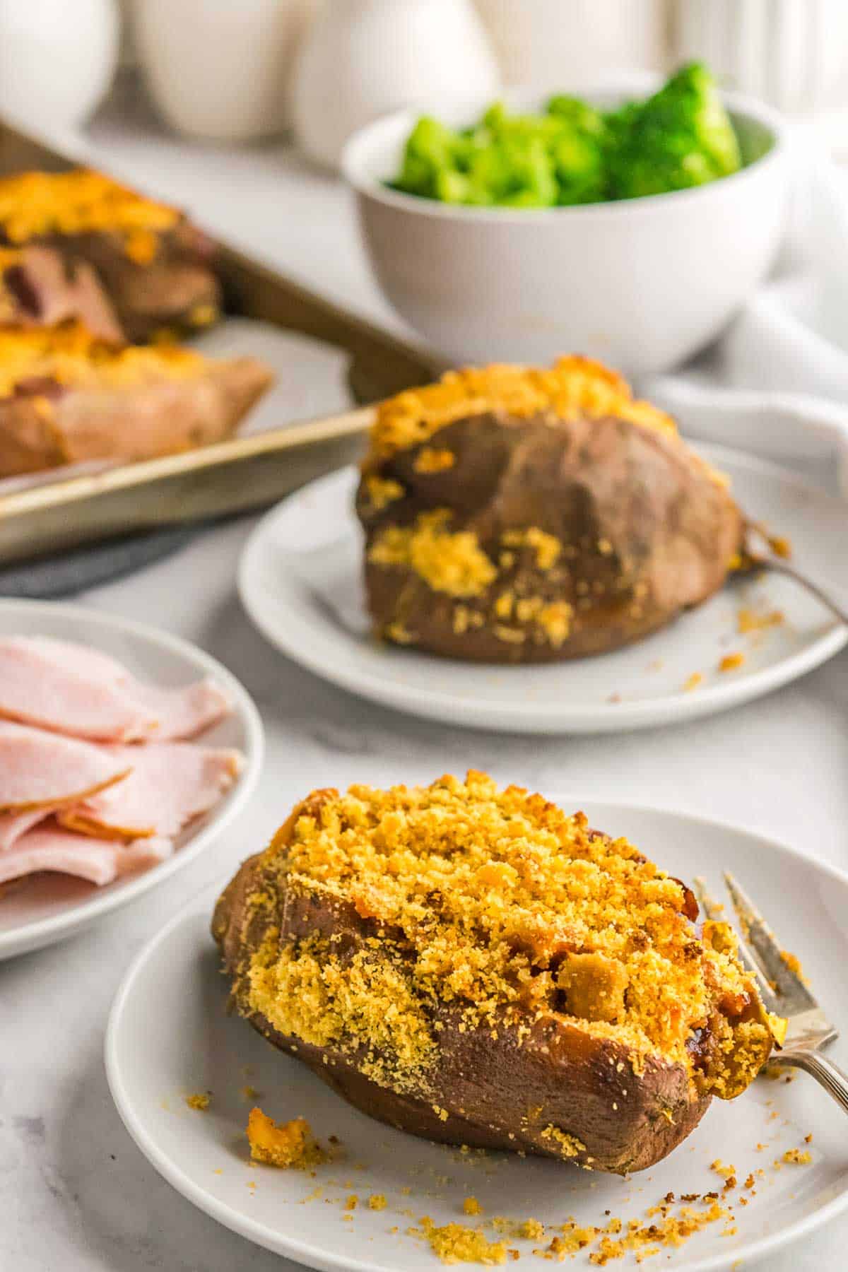 A stuffed sweet potato with a cheey crumb topping.