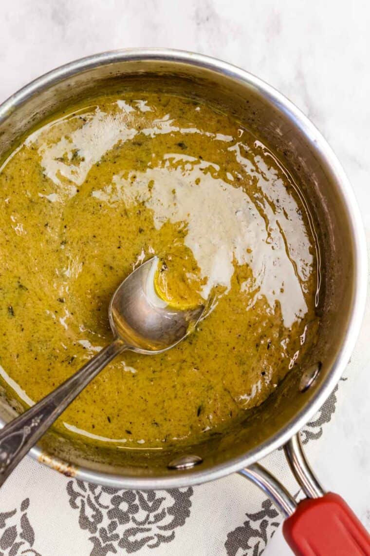 Reducing the marinade for bourbon pork tenderloin into a sauce.