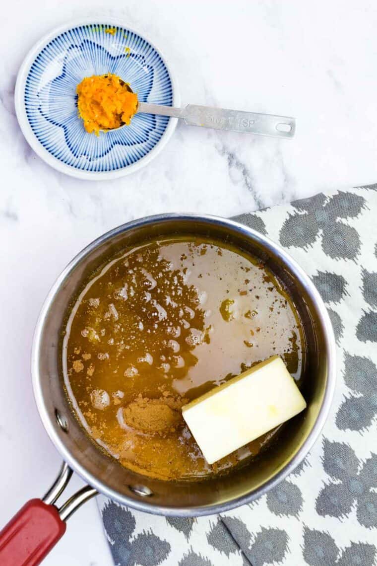 Orange juice, butter, sugar, salt, cinnamon, and nutmeg in a small saucepan.