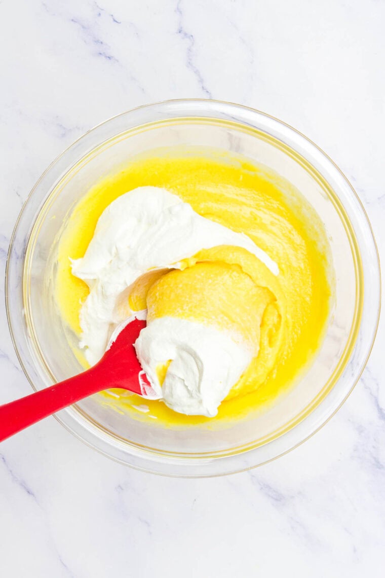 Folding Cool Whip into a mixture of eggnog and instant vanilla pudding mix.