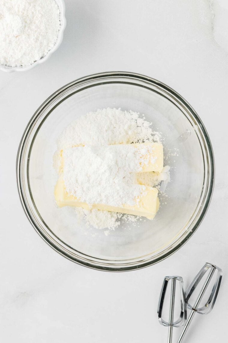 Butter and powdered sugar in a bowl.