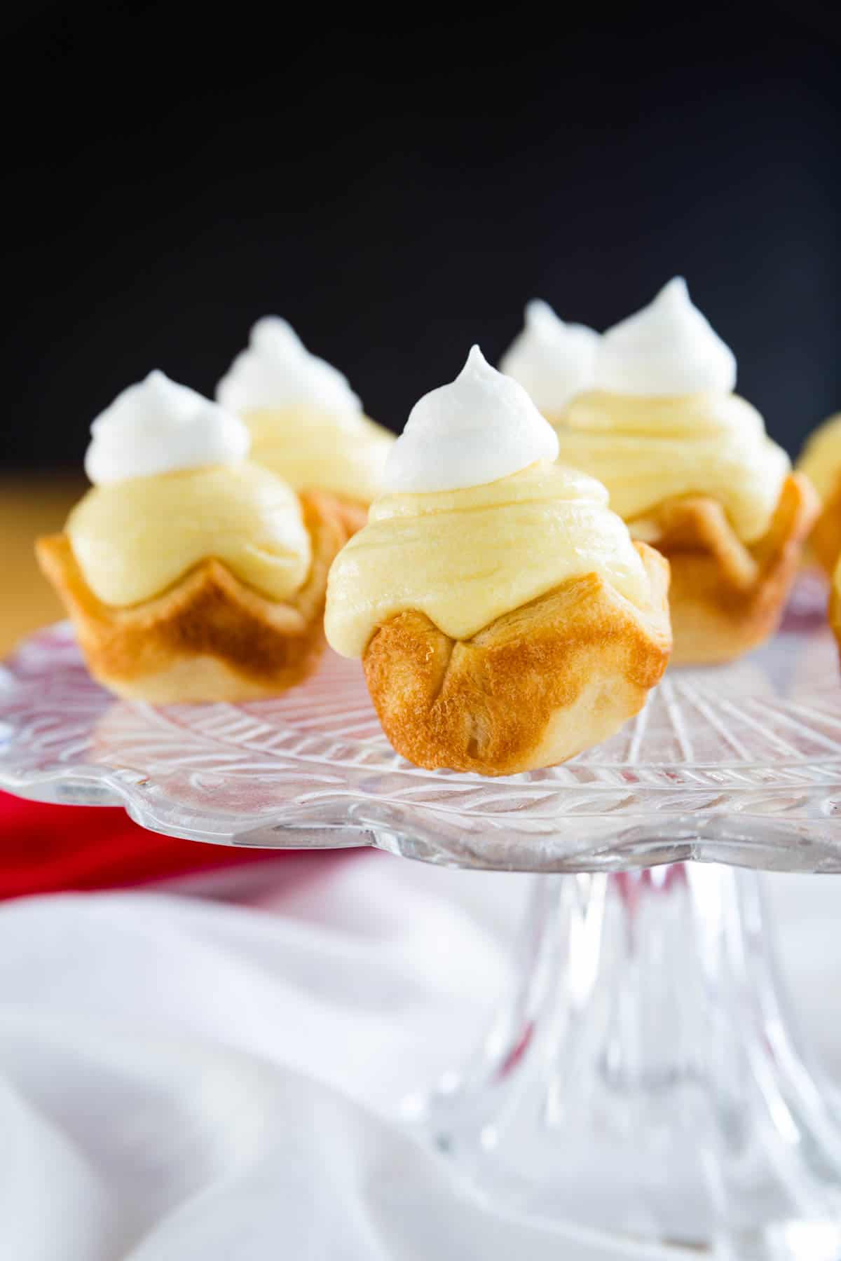 Mini eggnog pies on a cake stand.