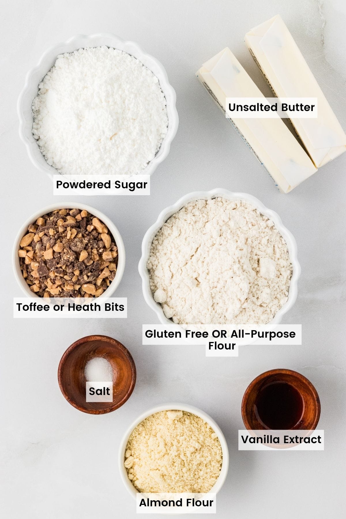 Labeled ingredients for toffee almond snowball cookie recipe.