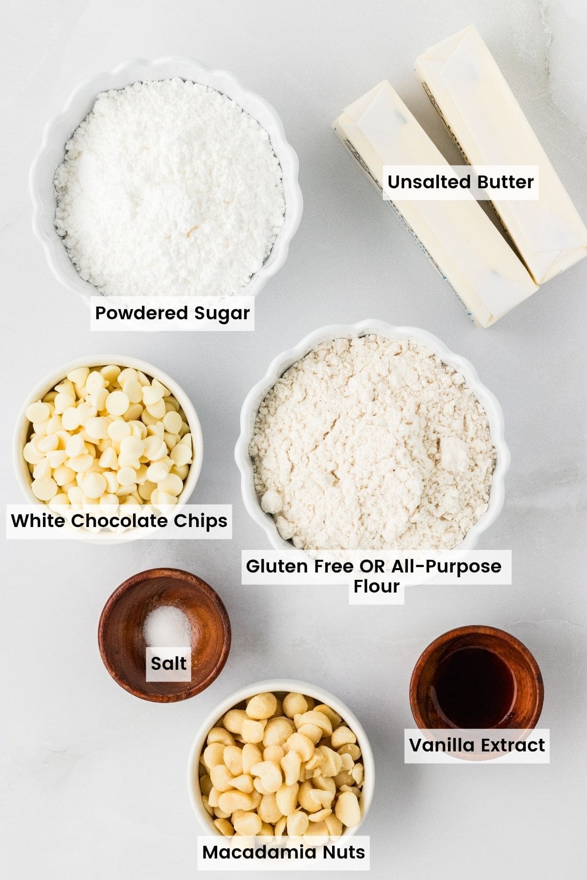 Labeled ingredients for white chocolate macadamia snowball cookies recipe.