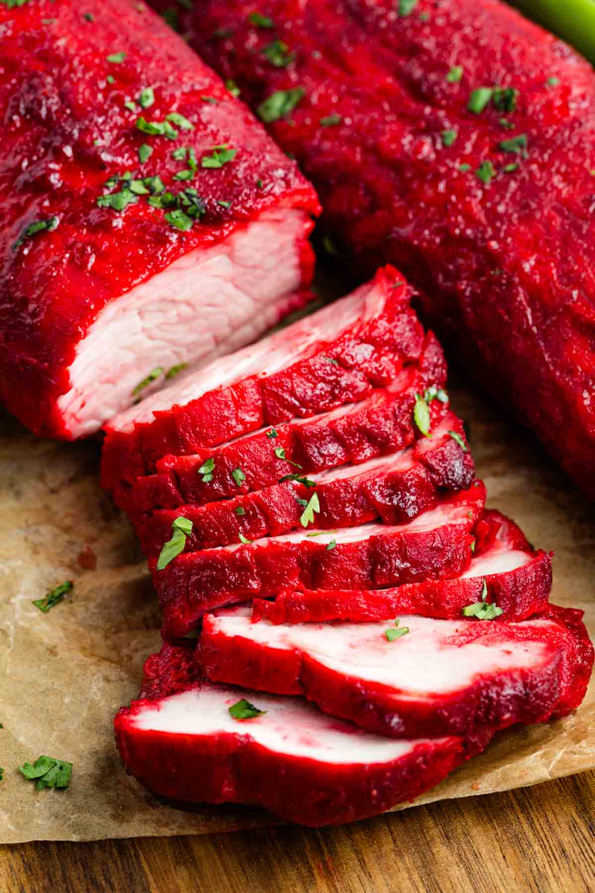 Close up of a Char Siu pork tenderloin sliced into pieces