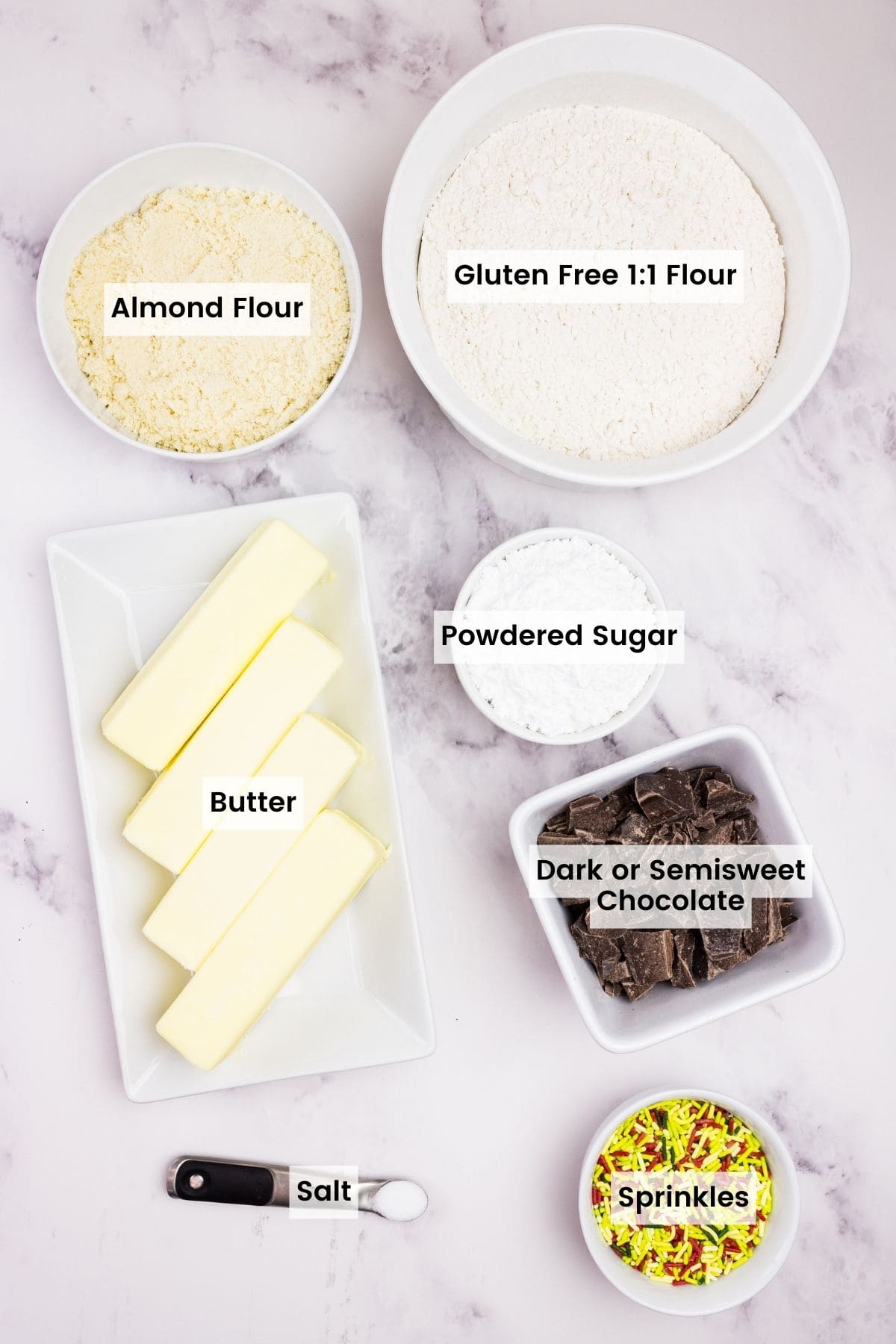 Ingredients to make almond crescent cookies with text labels.