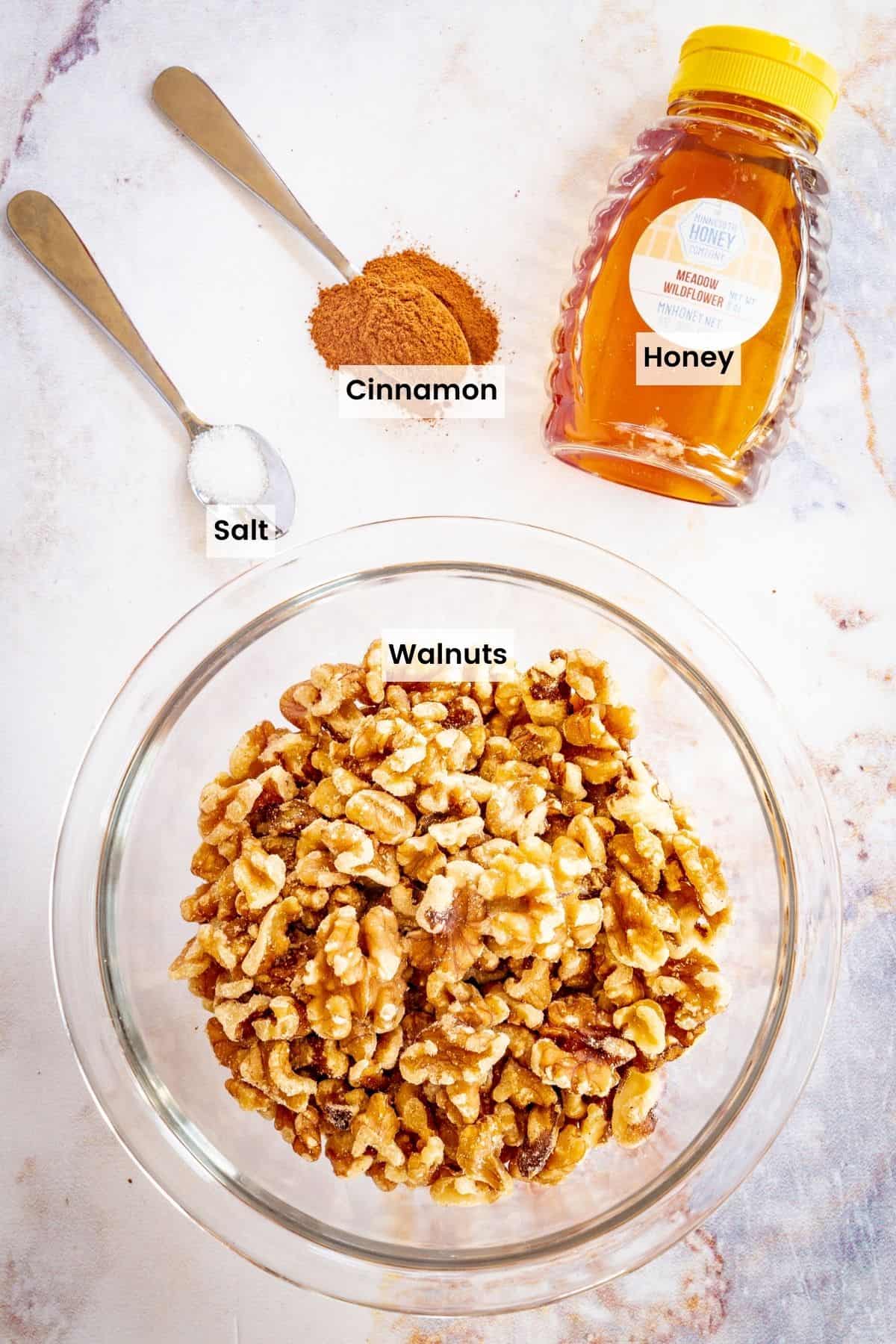 Ingredients to make honey glazed walnuts with text labels.
