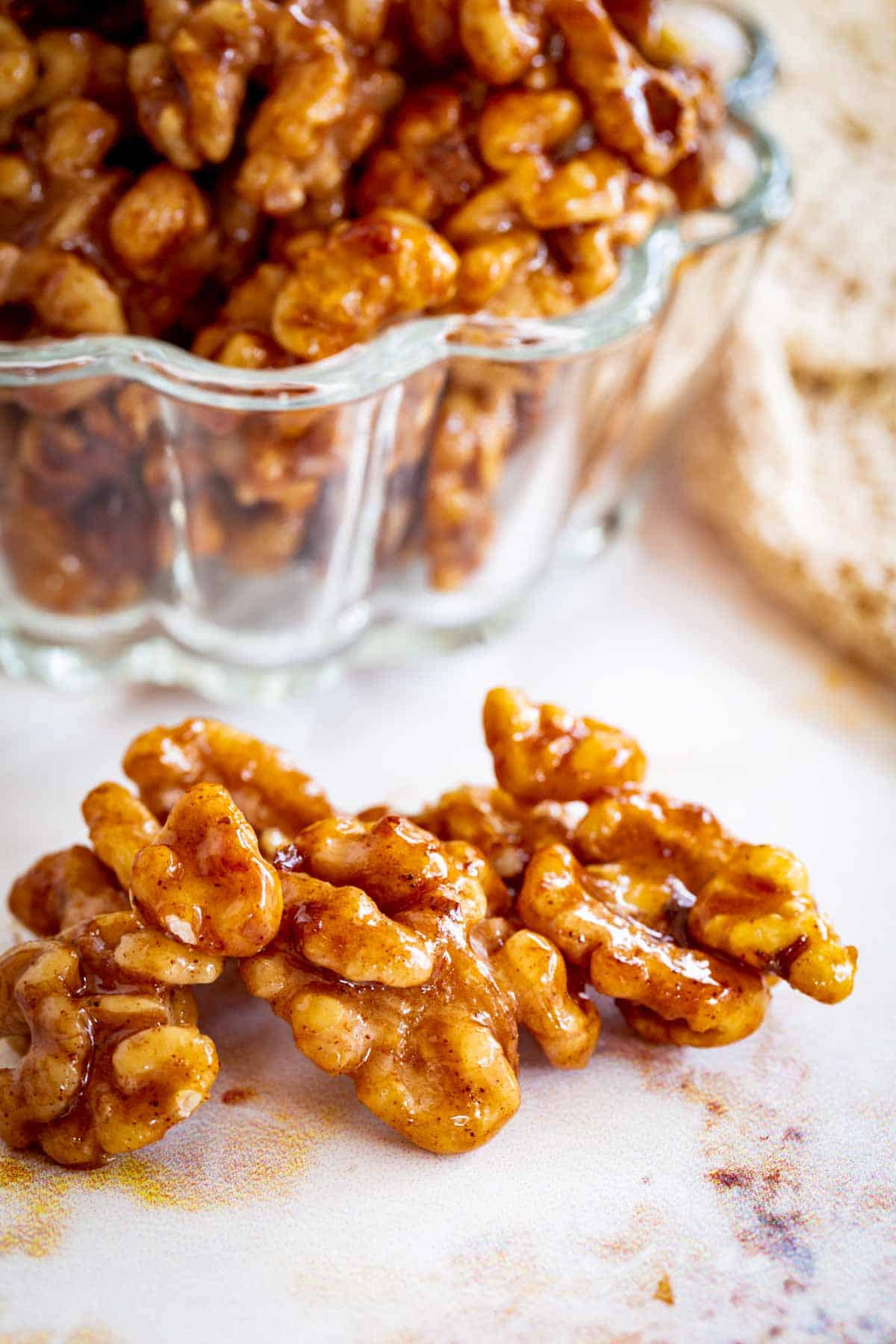 Glazed nuts on a countertop.