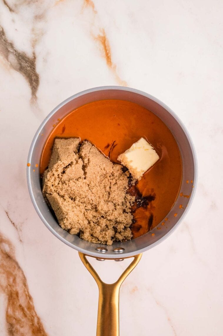 Hot sauce, brown sugar, and butter in a saucepan