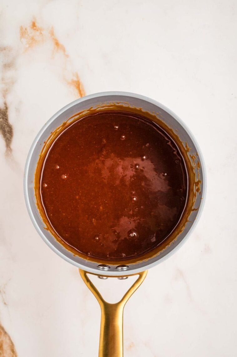 Buffalo wing sauce in a saucepan