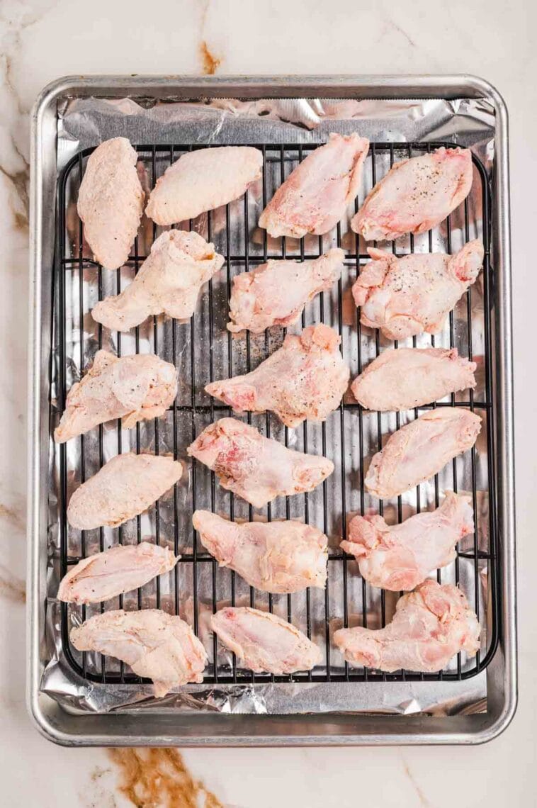 Wings on a wire rack over a baking sheet