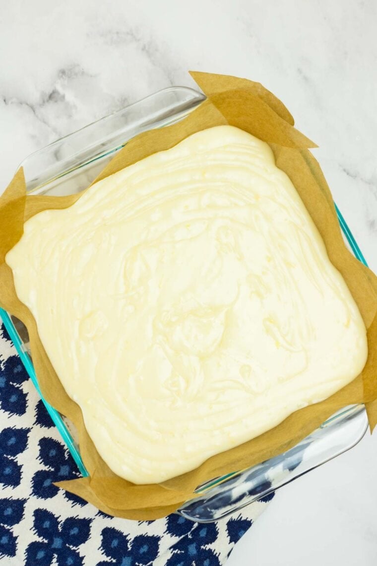 Melted white chocolate and sweetened condensed milk poured into a square pan