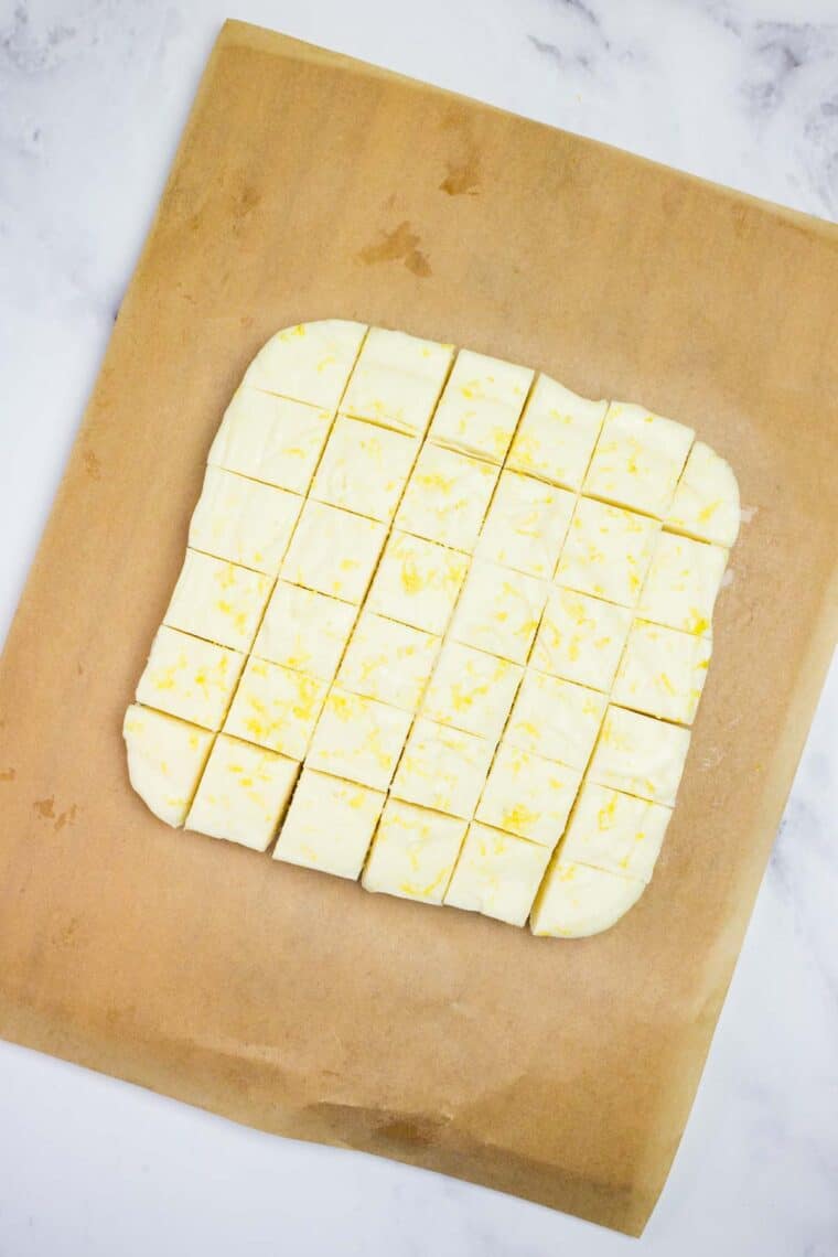 Overhead view of lemon fudge cut into squares