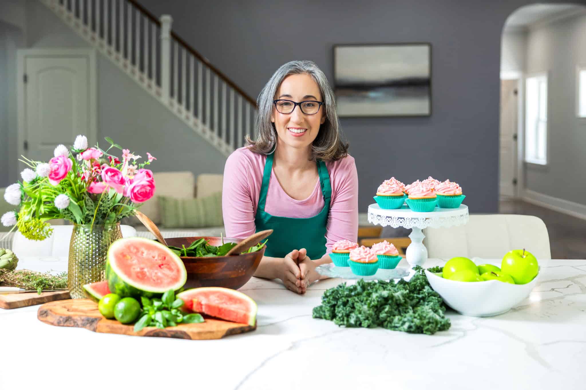 Brianne Izzo in bright kitchen making gluten-free recipes for Cupcakes & Kale Chips.