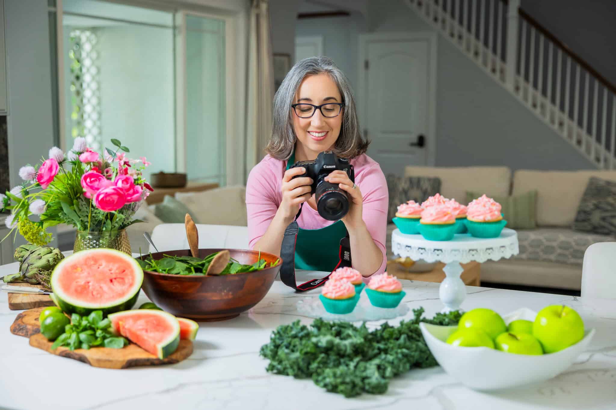 Brianne Izzo photographing food setup to test and document gluten-free recipes.