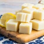 A pile of lemon fudge on a cutting board