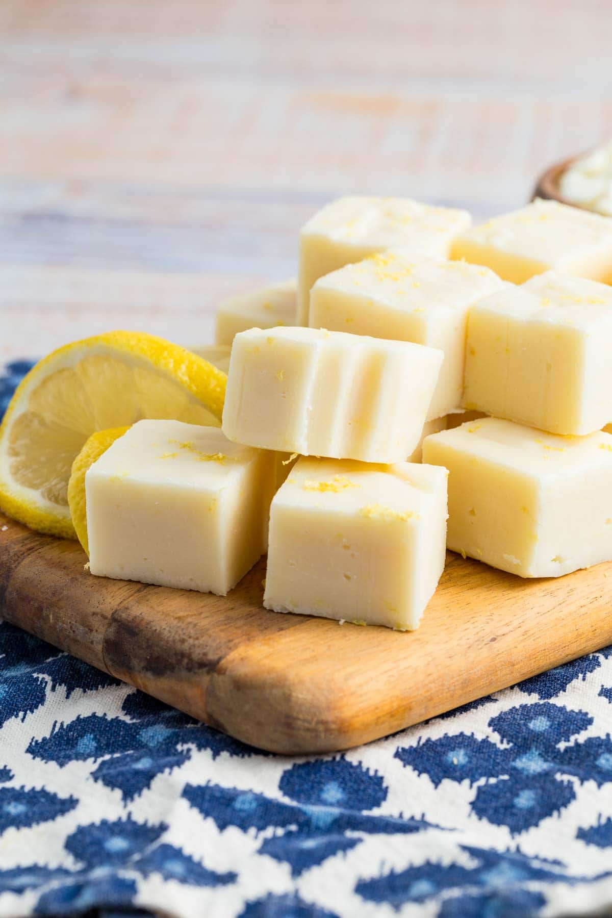 A pile of lemon fudge on a cutting board