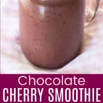 A smoothie with frozen cherries and cacao nibs on top in a glass jar and a closeup of the garnishes divided by a purple box with text overlay that says "Chocolate Cherry Smoothie" and the words easy, sweet, and gluten free.