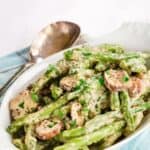Green beans and mushrooms coated in a creamy sauce with text overlay that says "Creamy Green beans and Mushrooms".