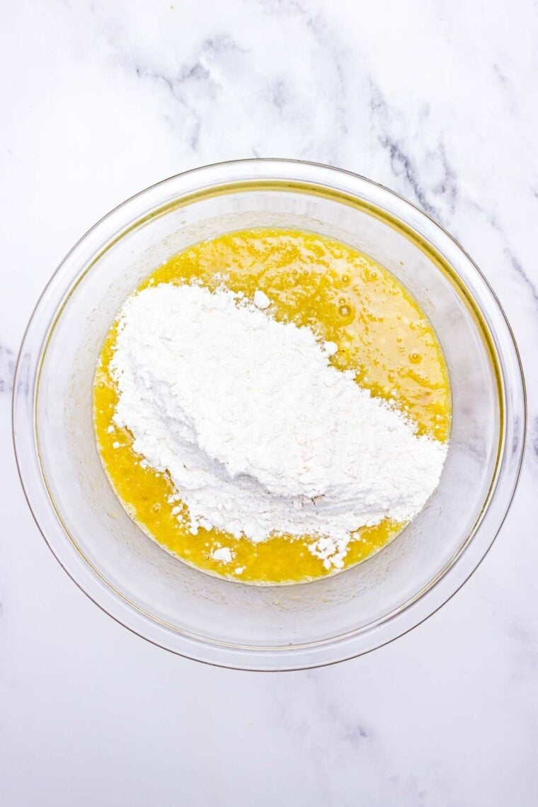 Adding the wet and dry ingredients in a bowl