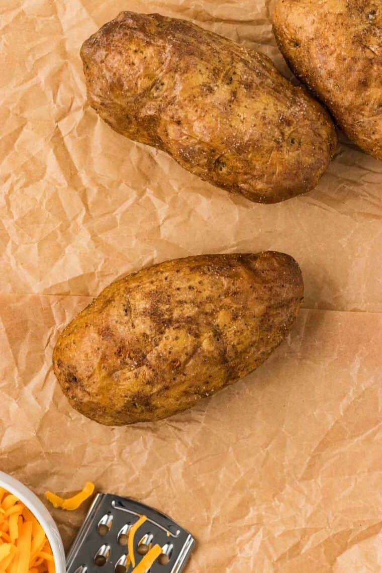 A baked potato on parchment paper