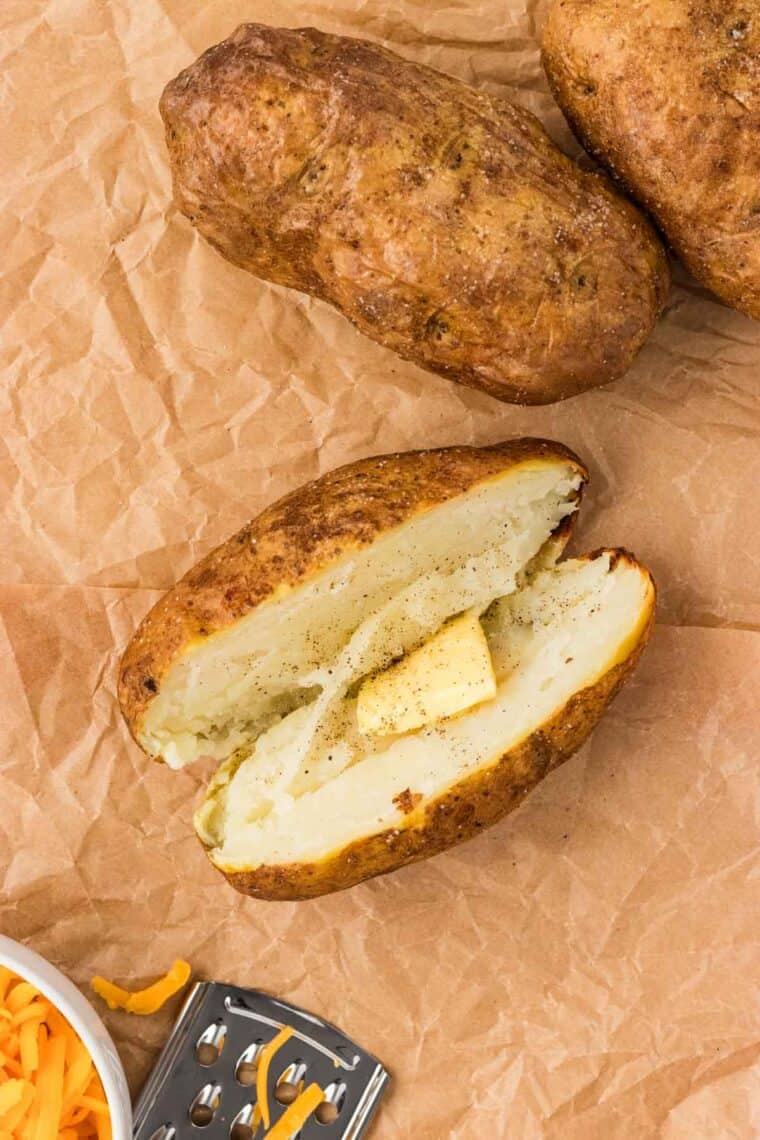 Butter added to the inside of a baked potato