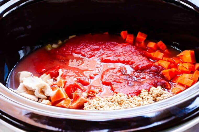All of the ingredients for the recipe added to the crockpot.