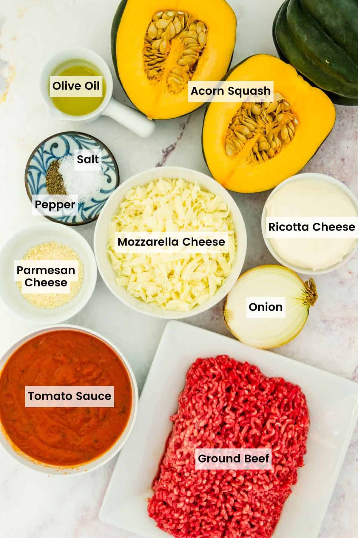Ingredients for ground beef stuffed acorn squash with text labels.