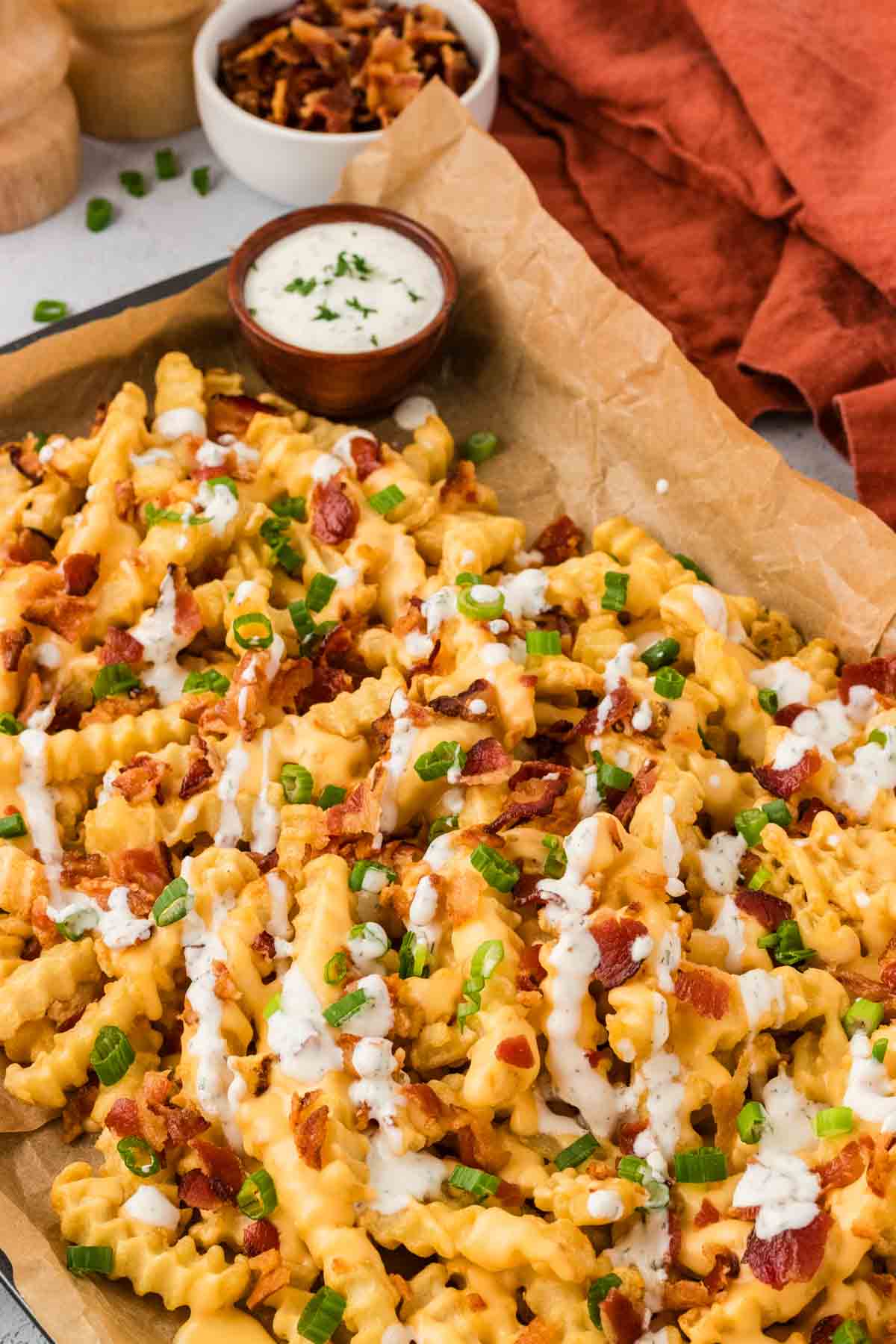 Loaded french fries on a baking sheet