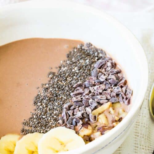 A close-up of the toppings on a chocolate smoothie bowl.