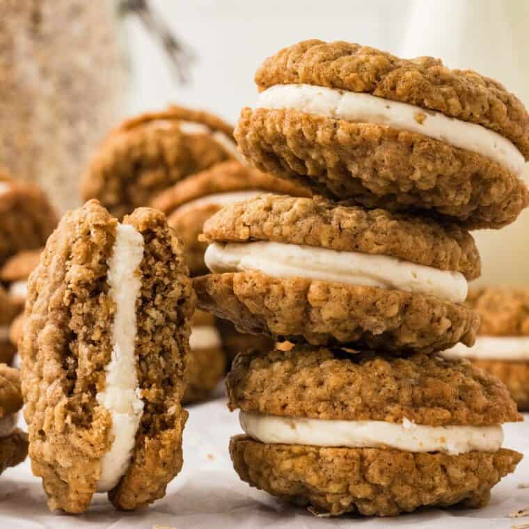 A stack of three homemade oatmeal cream pies with one leaning against them