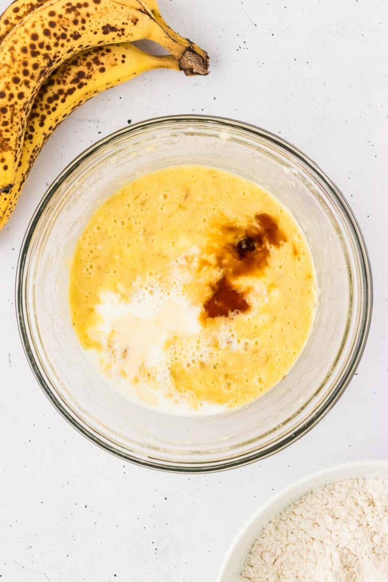 Milk and vanilla added to the mashed banana and egg