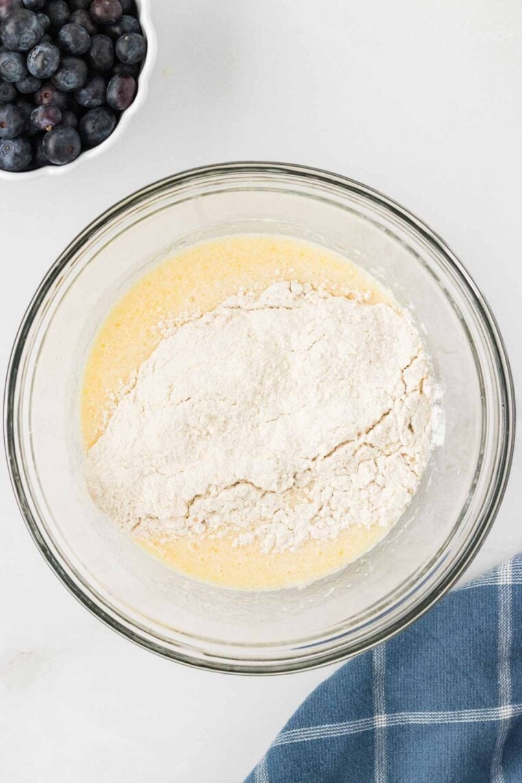 Adding the dry ingredients to the wet pancake batter