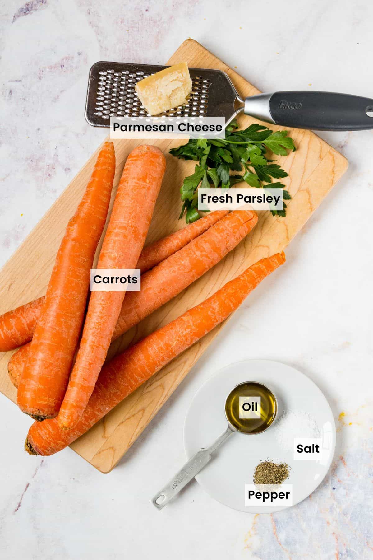 The ingredients for air fryer roasted carrots with text labels.