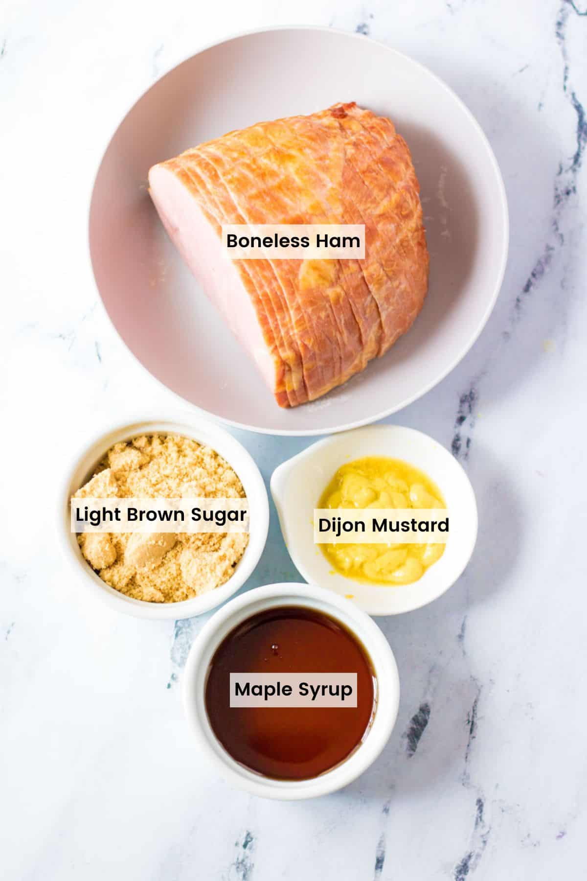 Ingredients to make an air fryer ham with maple glaze with text labels.