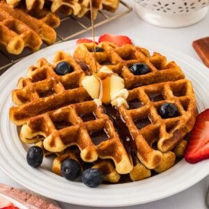 A plate of gluten free buttermilk waffles with fruit