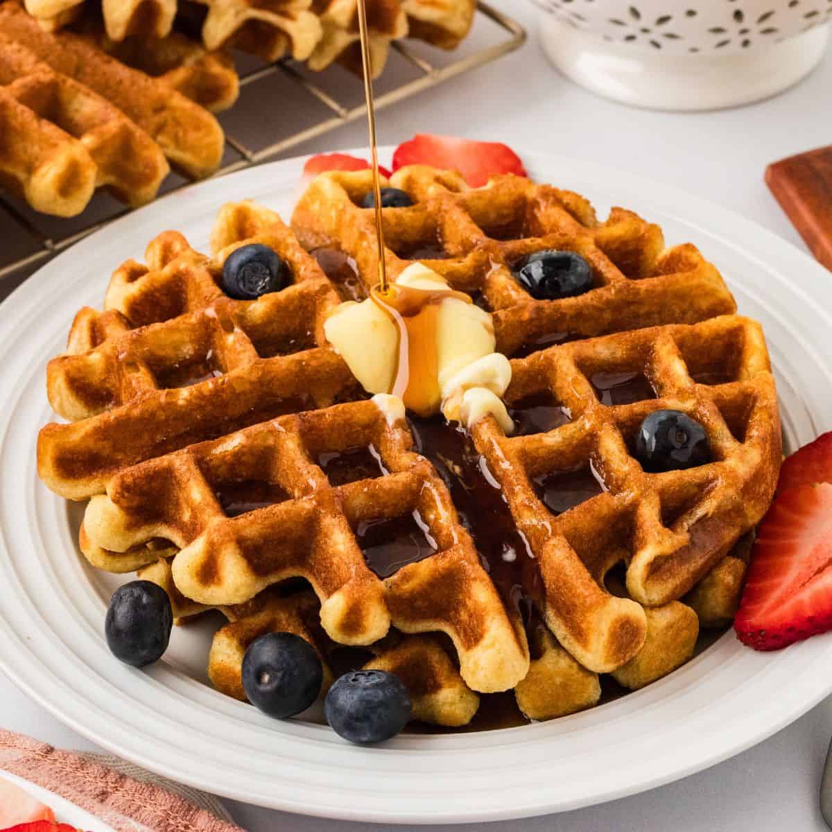 A plate of gluten free buttermilk waffles with fruit
