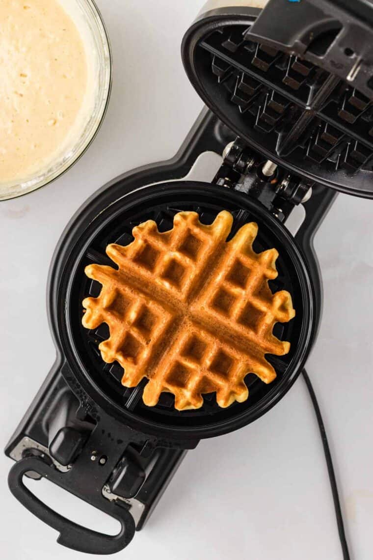 A buttermilk waffle in a waffle iron